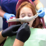 a girl thats getting surgery done on the mouth sedated and relaxed